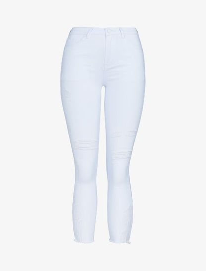 Jean 7/8 con ginocchia strappate e dettagli di usura. - bianco