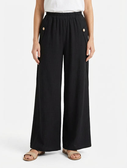 Pantaloni ampi tinta unita con bottoni decorativi. - Nero