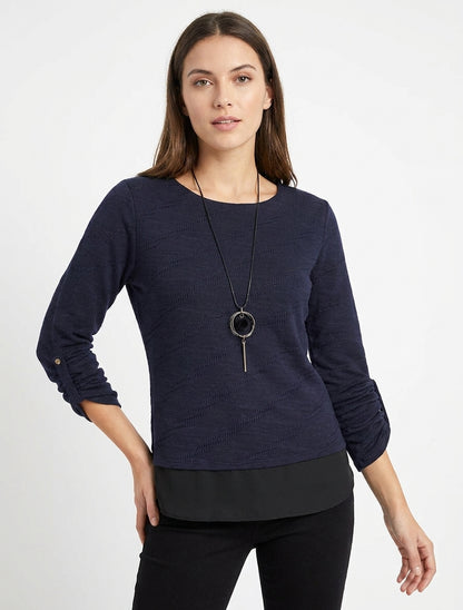Maglione testurizzato con scollo rotondo e fodera a vista. - Marina